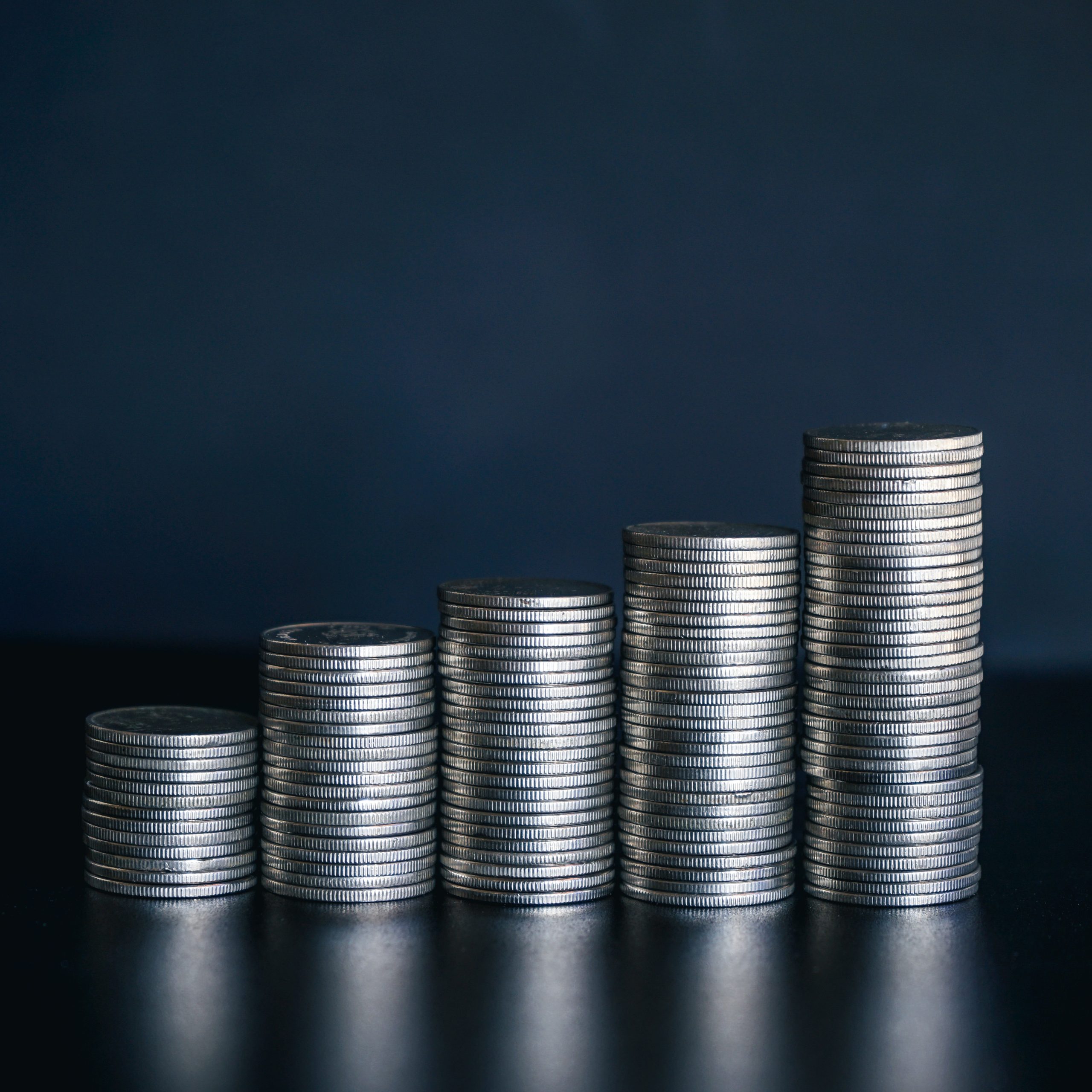 coin-stacks-illustrate-growth-against-dark-backgro-2026-01-07-02-15-44-utc