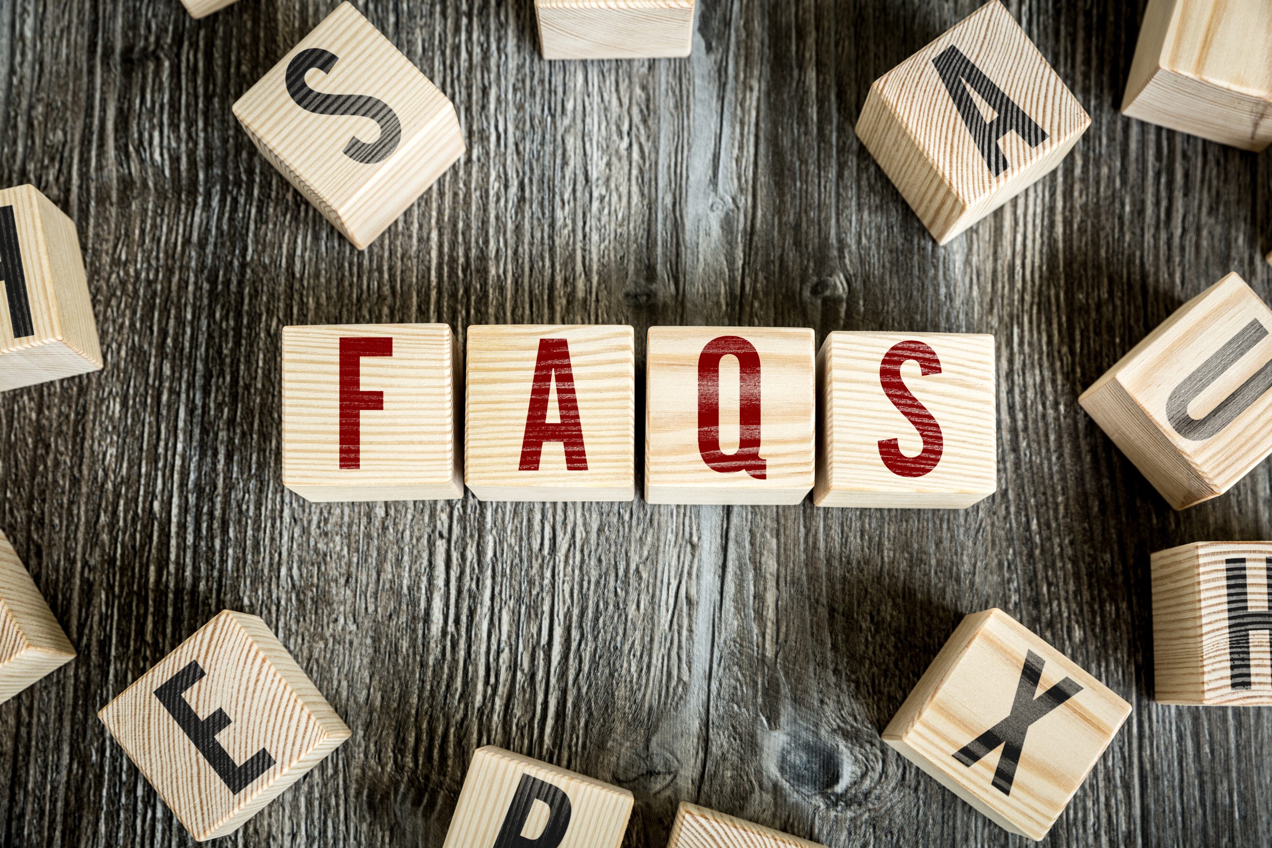 faqs-spelled-out-in-wooden-blocks-on-wood-2026-04-13-23-13-27-utc