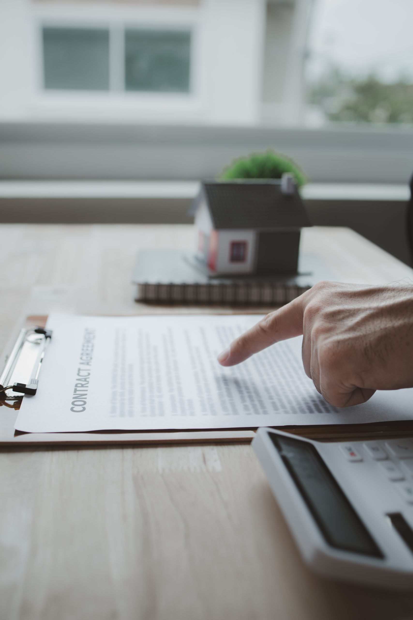 House sales representatives, sales representatives recommend housing details in the project to customers who are interested in viewing the houses in the project. Real estate trading concept.